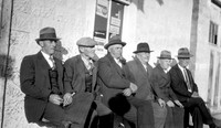 Group of men on street, Brainerd, NE 1934